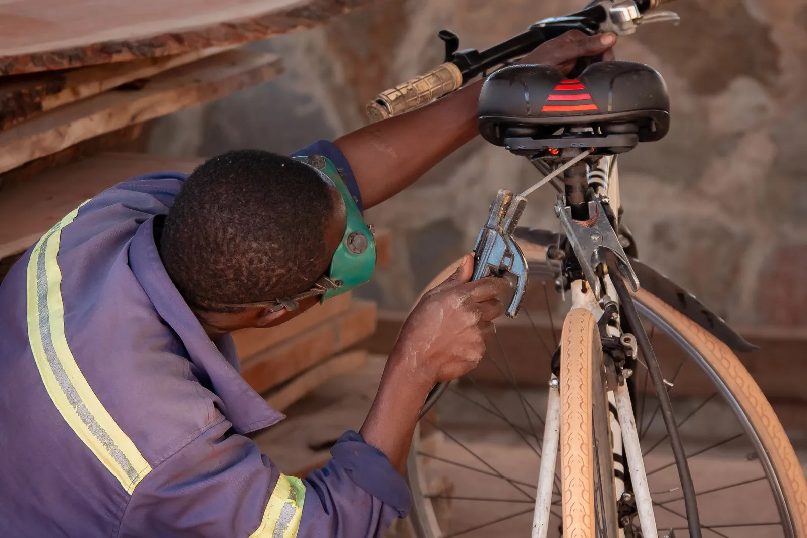 Bicycle mechanic working on an electric bike in a repair workshop